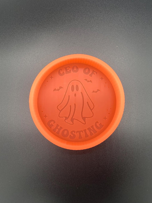 May include: Orange silicone mold with a ghost design and the text &#39;CEO OF GHOSTING&#39;.